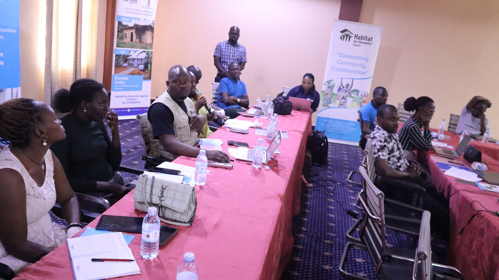 Families and community members supported by Habitat Uganda