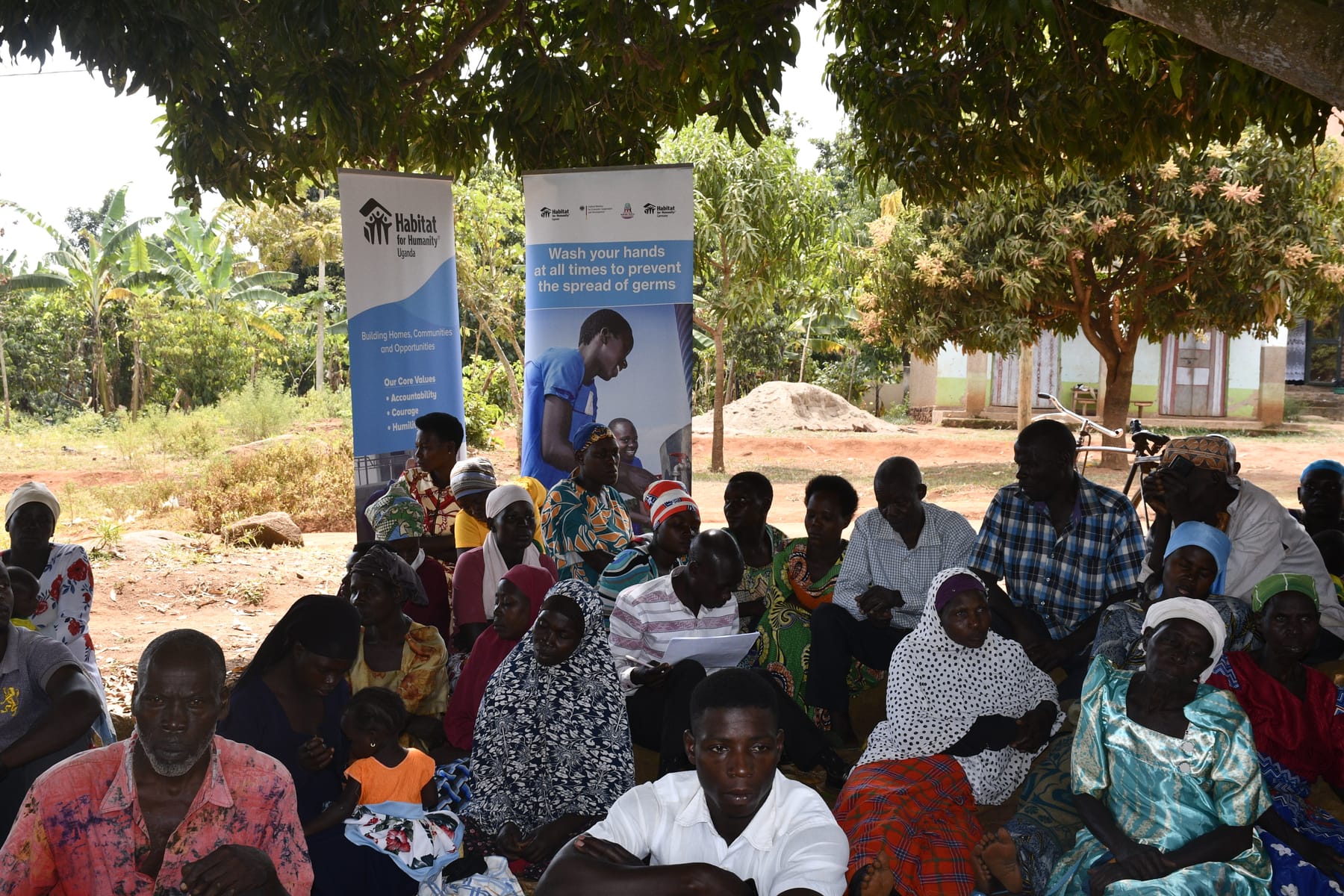 Families and community members supported by Habitat Uganda